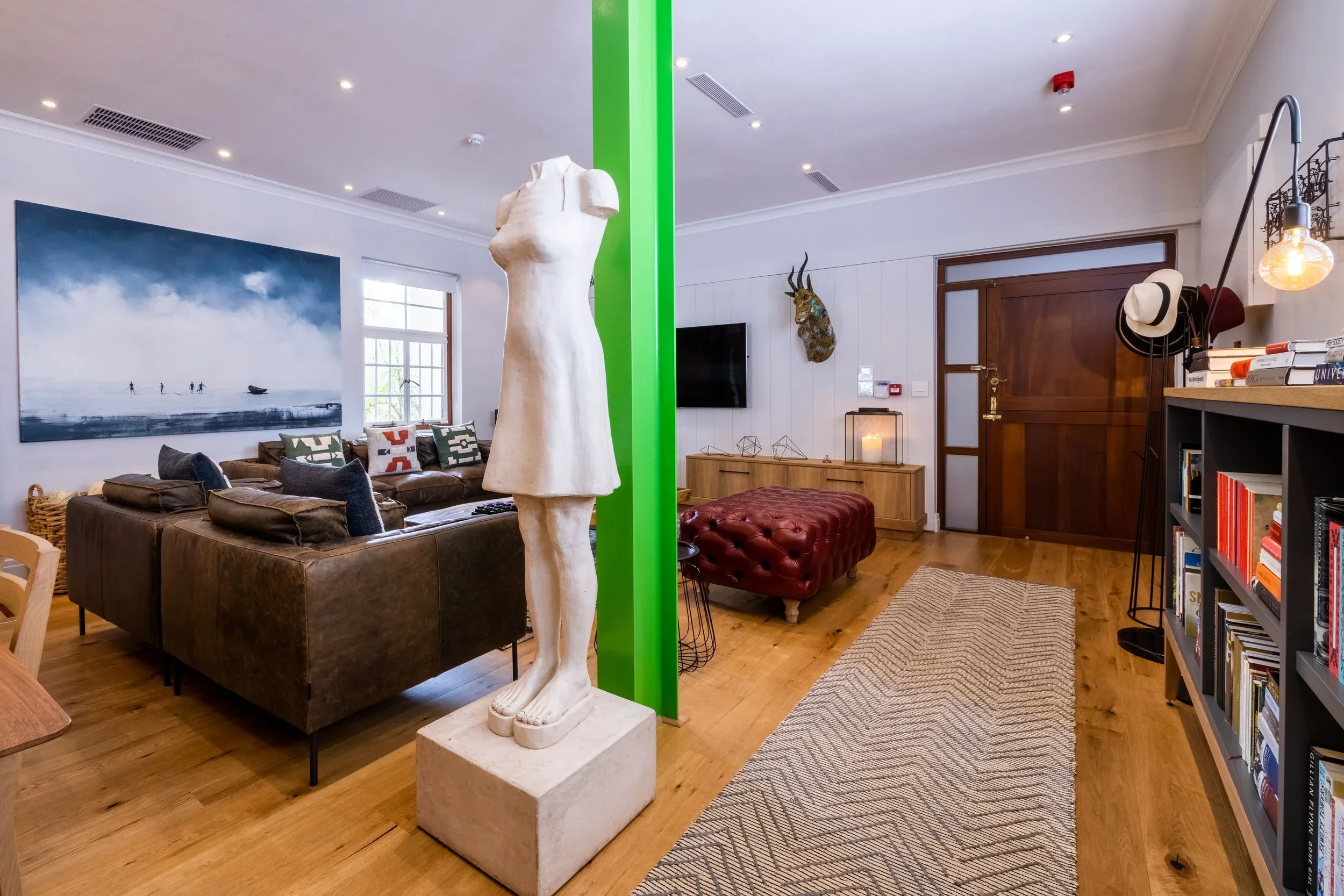 The sitting area in the Town apartment, with its sofas and artwork