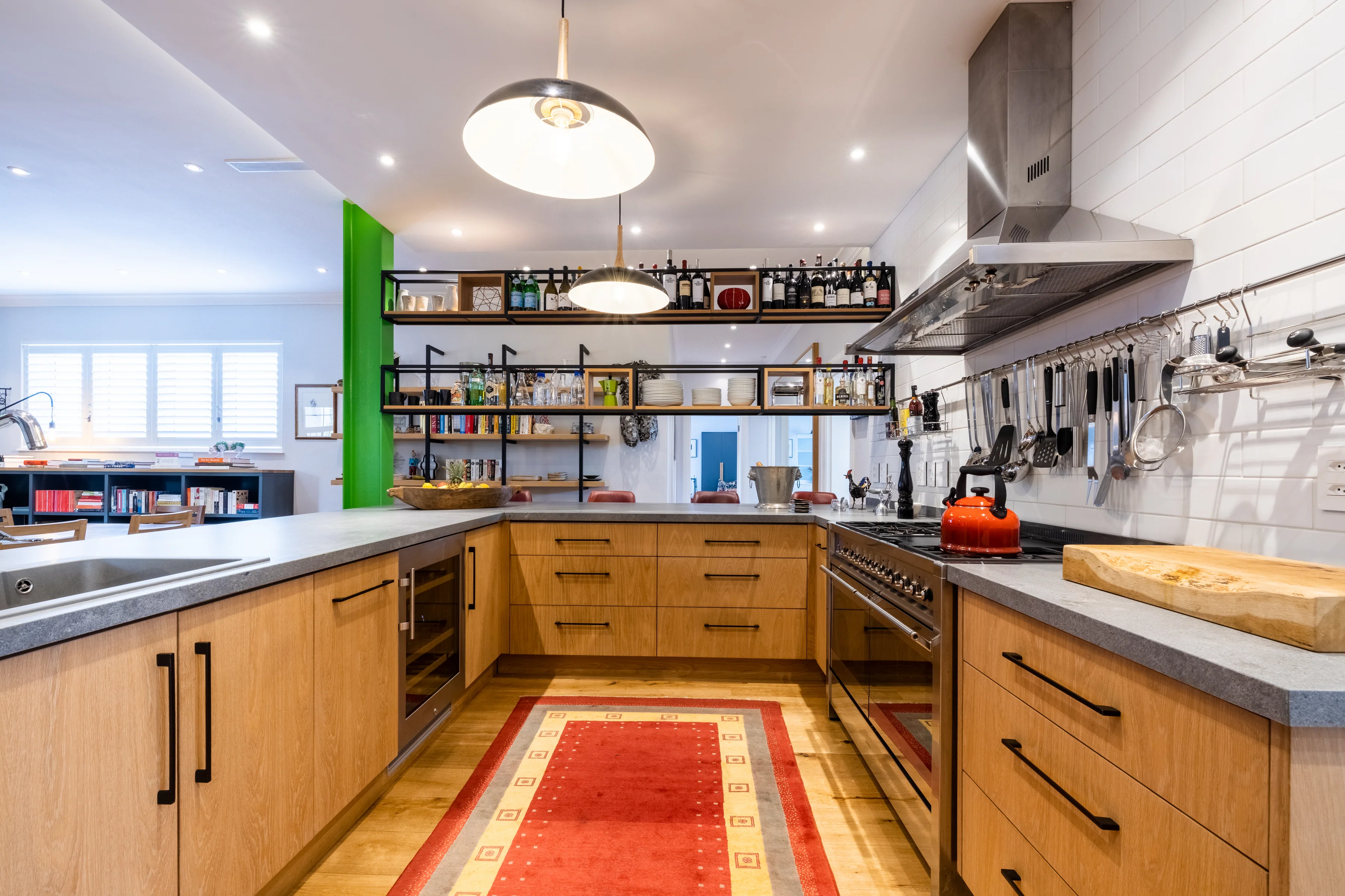The galley kitchen, with hanging utensils and the extractor